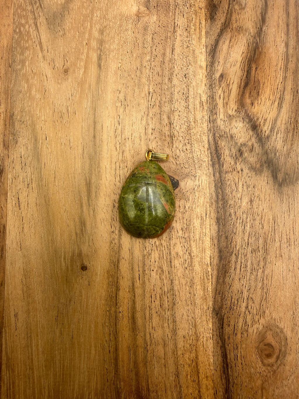 Carved Unakite pendant