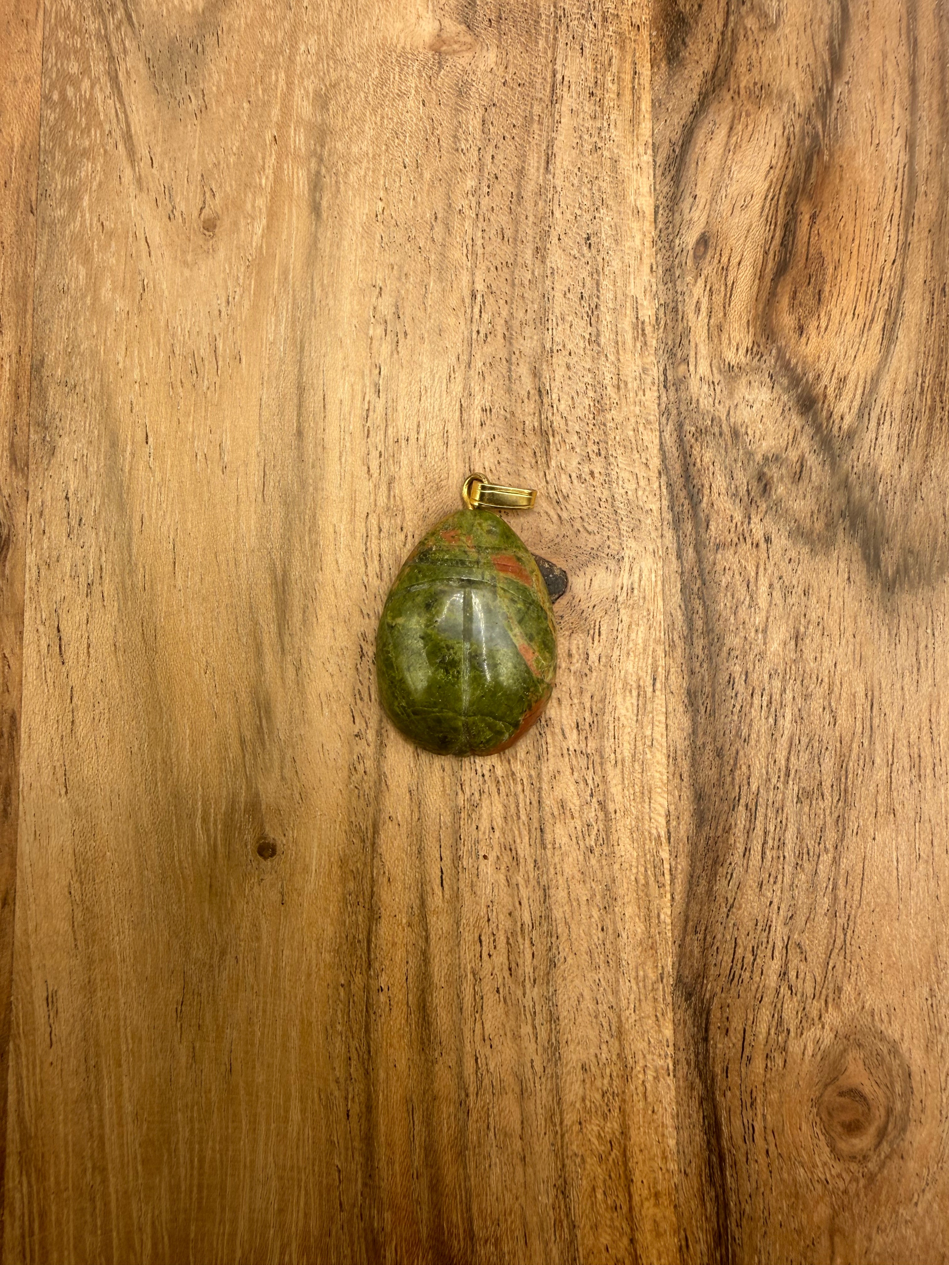 Carved Unakite pendant
