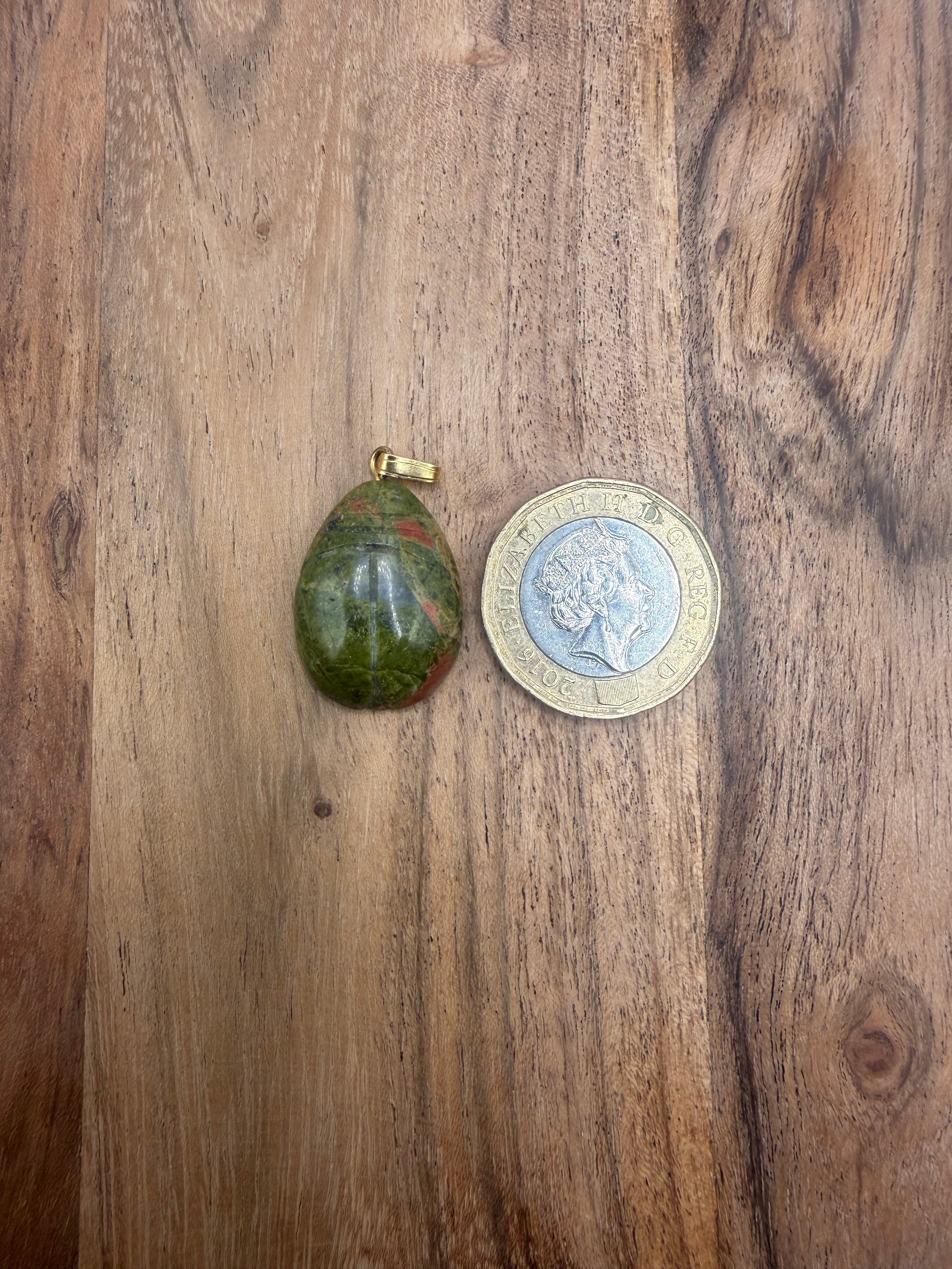 Carved Unakite pendant